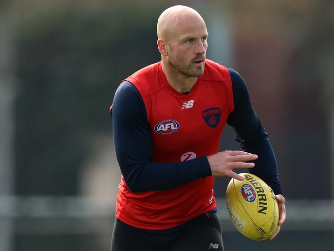 MELBOURNE, AUSTRALIA - AUGUST 27: Nathan Jones of the Demons runs with the ball during a Melbourne Demons AFL training session at Gosch's Paddock on August 27, 2021 in Melbourne, Australia. (Photo by Robert Cianflone/Getty Images)