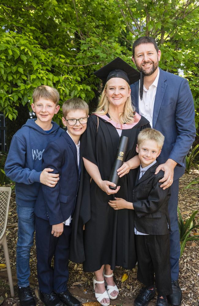 Master of Education (Distinction) graduate Lisa Evans with family (from left) Hyrum, Thomas, Ben and Brendon Evans at a UniSQ graduation ceremony at Empire Theatres, Tuesday, October 31, 2023. Picture: Kevin Farmer