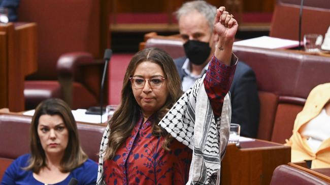 The NSW senator was draped in a keffiyeh as she staged the protest. Picture: NCA NewsWire / Martin Ollman