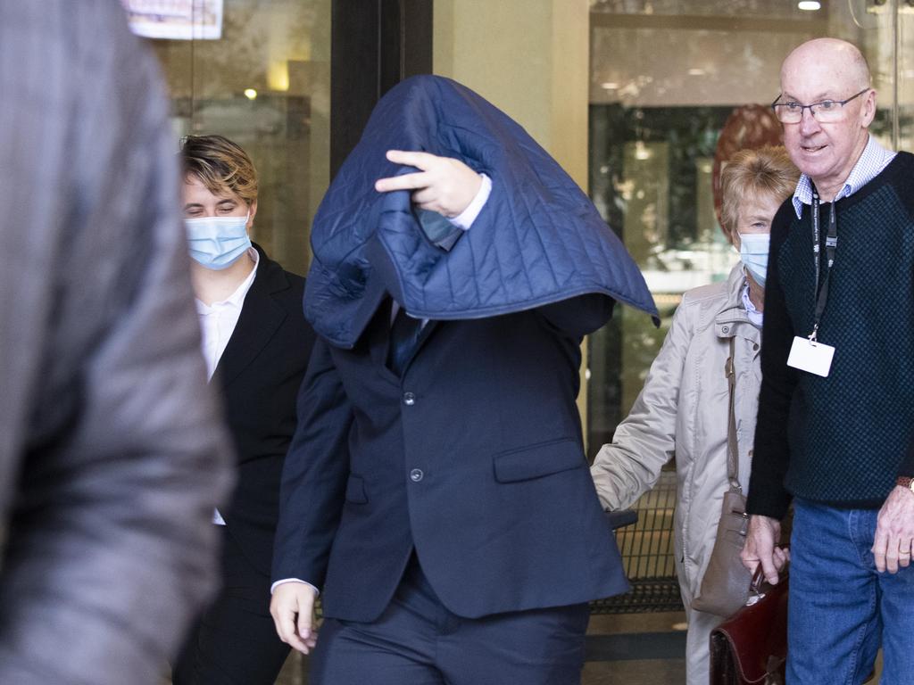 Zane Clark (with jacket over head) shielded his identity when he left court on a previous occasion. Picture: NewsWire/Monique Harmer.