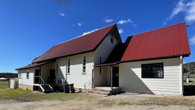 The outside of the Stanthorpe Little Theatre, with the structure on the right recently built. Pictured: President Shannon Cox. Photo: Madison Mifsud-Ure / Stanthorpe Border Post