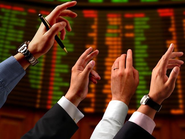 Share price, bull, bear, shares, stocks. Hands raised into the air and electronic stock market board.