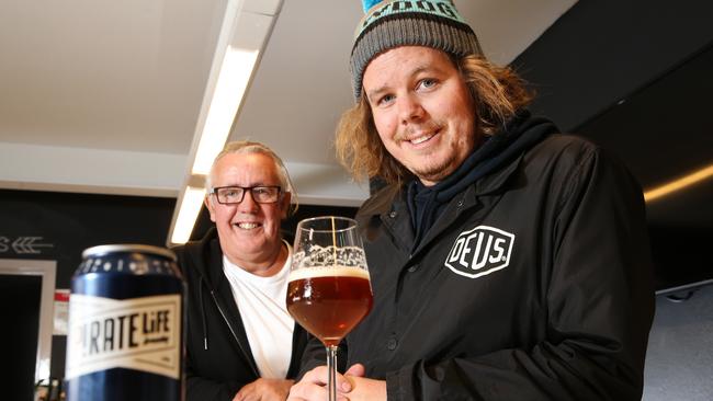 CEO and co-founder of Pirate Life Brewing Michael Cameron with his son Jack Cameron, Co-founder and brewer with a pale ale. Picture: Stephen Laffer