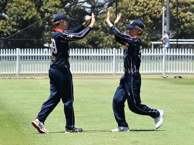 Harry Austin (left) celebrates his catch in the outfield. Picture: Sean Teuma