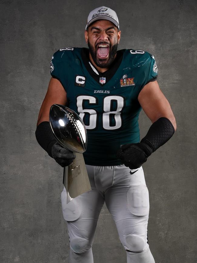 Jordan Mailata with the Vince Lombardi trophy celebrating the 2025 Super bowl win. Picture Ryan Kang