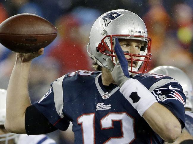 FILE - In this Jan. 18, 2015, file photo, New England Patriots quarterback Tom Brady looks to pass during the first half of the NFL football AFC Championship game against the Indianapolis Colts in Foxborough, Mass. An NFL investigation has found that New England Patriots employees likely deflated footballs and that quarterback Tom Brady was 