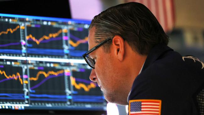 A traders working on the floor of the New York Stock Exchange.