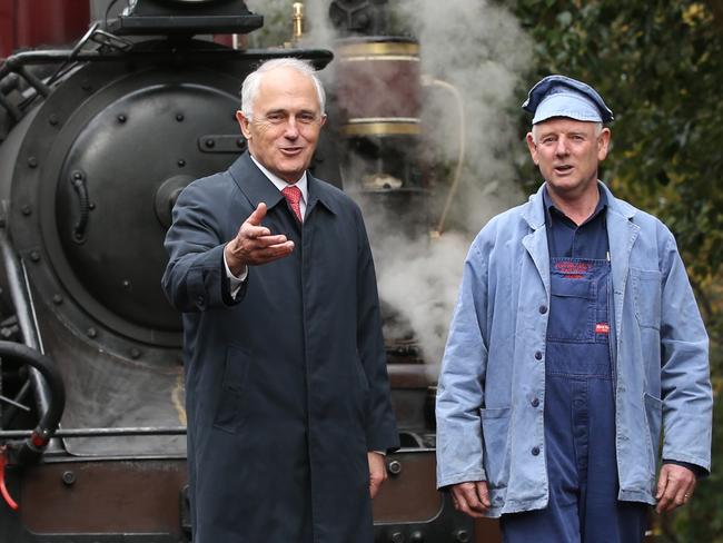 Prime Minister Malcolm Turnbull talks with train driver Lindsay Rickard, after taking a ride on the Puffing Billy in the Dandenong Ranges yesterday / Picture: Lyndon Mechielsen/News Corp