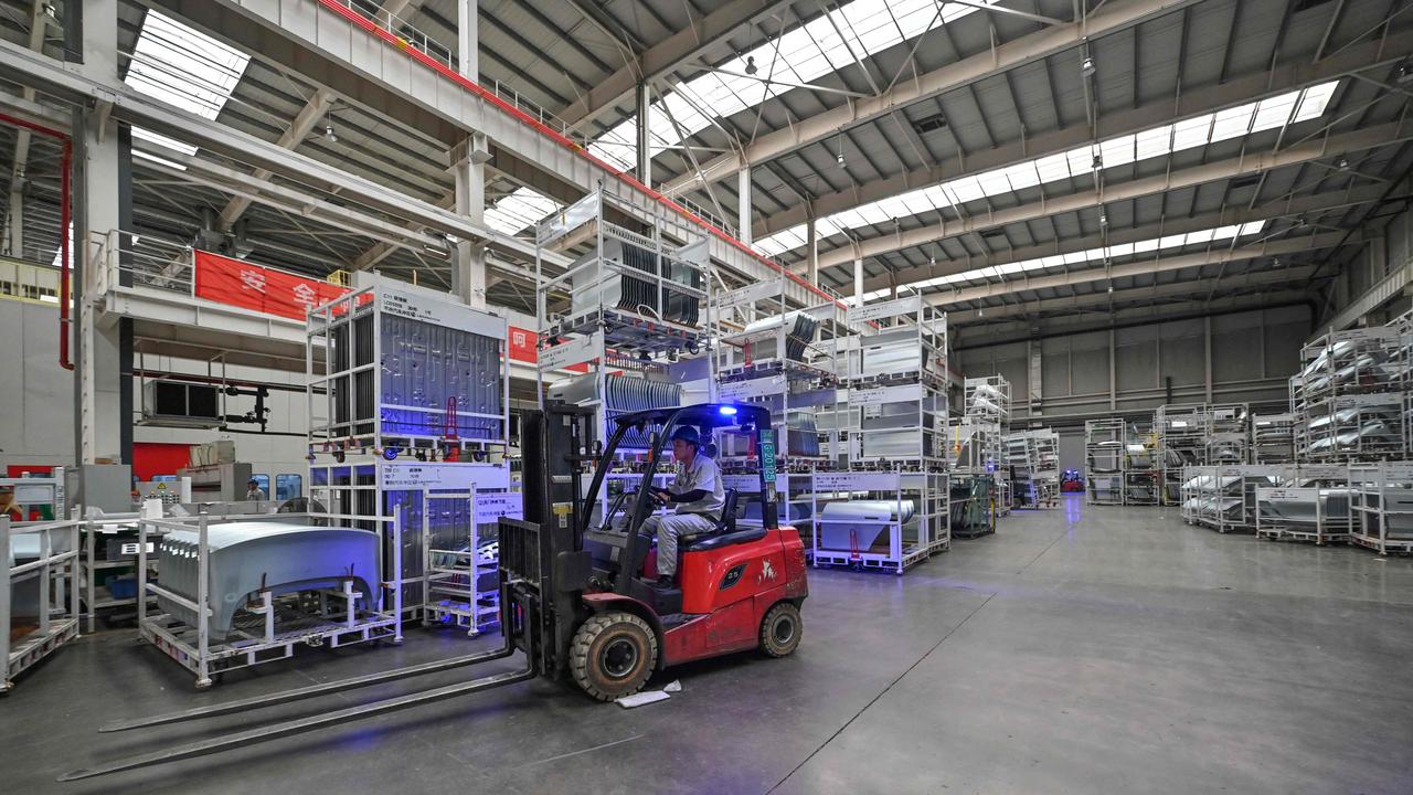 An employee drives a forklift at a factory of electric vehicle manufacturer Leapmotor in Jinhua, China's eastern Zhejiang province. Picture: Adek BERRY / AFP