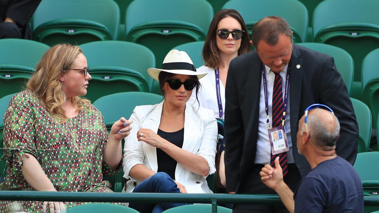 A man believed to be a Royal bodyguard had a stern chat with a spectator who had taken a selfie as the Duchess of Sussex watched the Serena Williams match at the Wimbledon Championships. Picture: Mike Egerton/PA Wire.