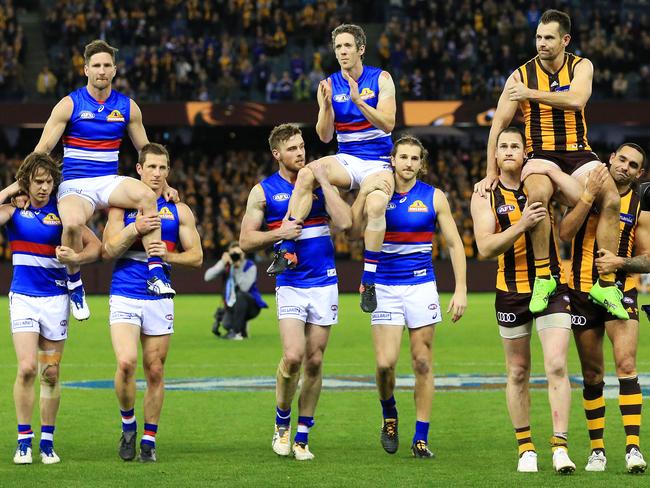 Matthew Boyd, Robert Murphy and Luke Hodge leave the ground. Picture: Mark Stewart