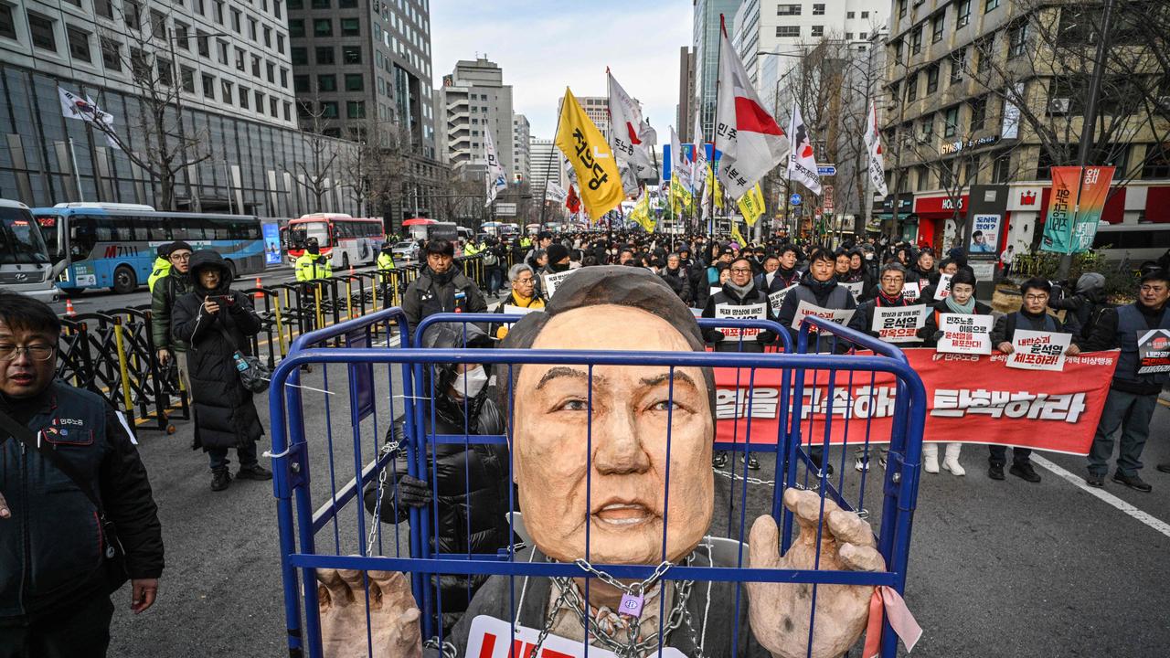 Demonstrators call for the impeachment of South Korea's President Yoon Suk Yeol outside City Hall in Seoul on December 12, 2024. After South Korea's president and his replacement were both deposed over a failed bid to impose martial law, deepening political turmoil is threatening the country's currency and shaking confidence in its economy. Picture: Anthony Wallace/AFP