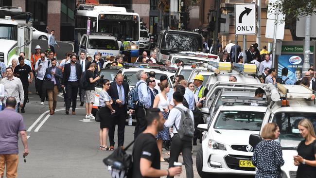 Streets are cordoned off by police as fire crews work to contain the fire. Picture: AAP.