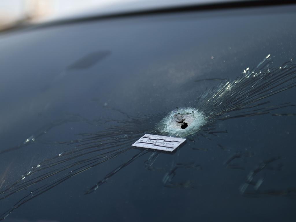 A bullet hole in a window of a vehicle is pictured near the Terminal 21 shopping mall. Picture: AFP