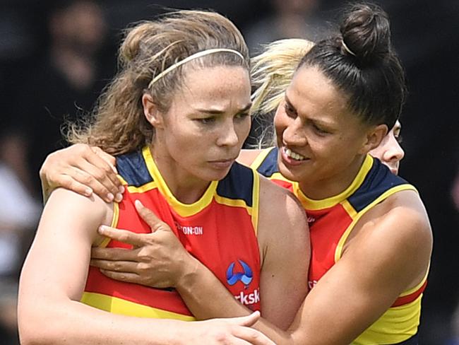 Jenna McCormick of the Crows celebrates a goal with teammates during the Round 3 AFLW match between the Adelaide Crows and the Western Bulldogs at Norwood Oval in Adelaide, Saturday, February 17, 2018. (AAP Image/Roy Vandervegt) NO ARCHIVING, EDITORIAL USE ONLY