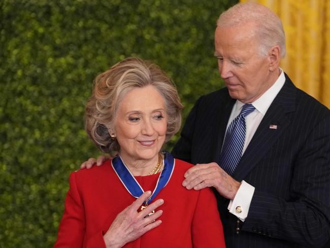 Hillary Clinton receives the Medal of Freedom from Joe Biden at the White House. Picture: AFP