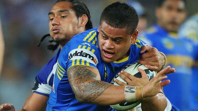 SYDNEY, AUSTRALIA - MARCH 14: Jacob Loko of the Eels is tackled by the Bulldogs defence during the round two NRL match between the Parramatta Eels and the Canterbury Bulldogs at ANZ Stadium on March 14, 2013 in Sydney, Australia. (Photo by Brendon Thorne/Getty Images)