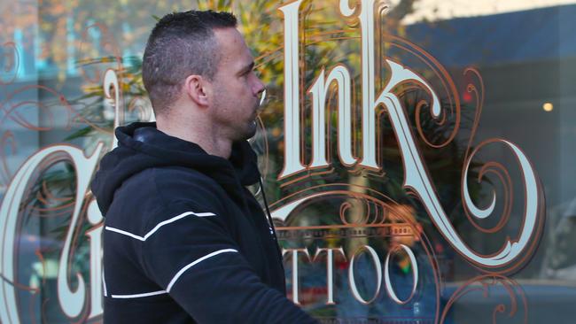 Former Tiger Jake King at his tattoo parlour after the drive-by shooting. Picture: David Crosling