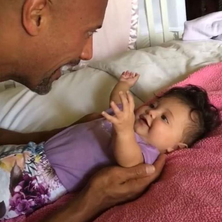 Dwayne Johnson with his daughter Simone, "Finally my big head is used for more than just a place to hang my hat. The joys of being home w/ my ohana and playin' one of our fav games - slap daddy's head 'til I can see his big scary face." Picture: Instagram