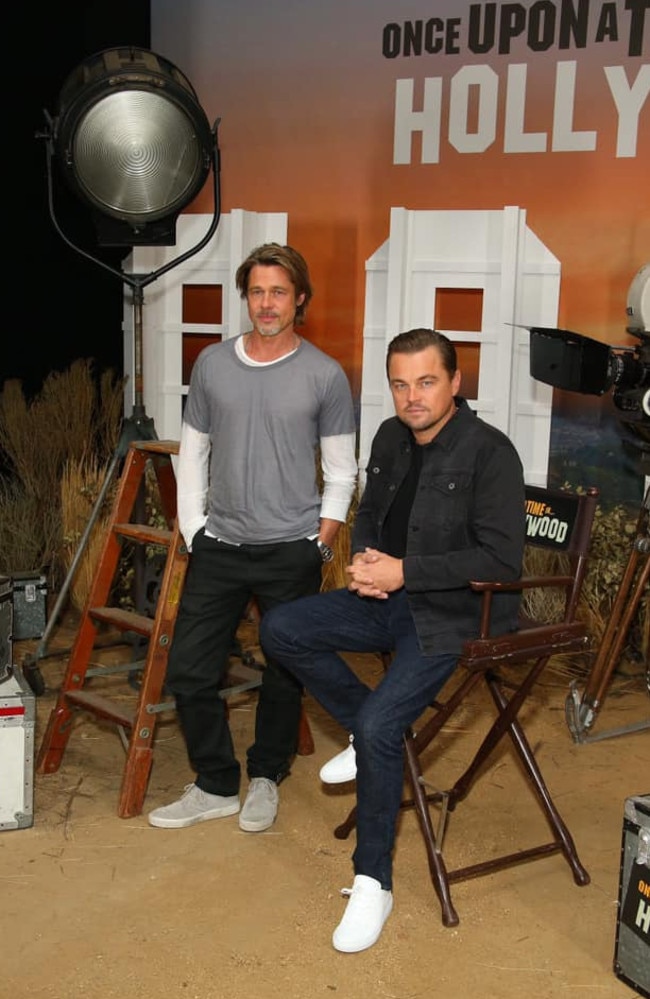 Leonardo DiCaprio wearing Outland Denim jeans and jacket while promoting a film with Brad Pitt.