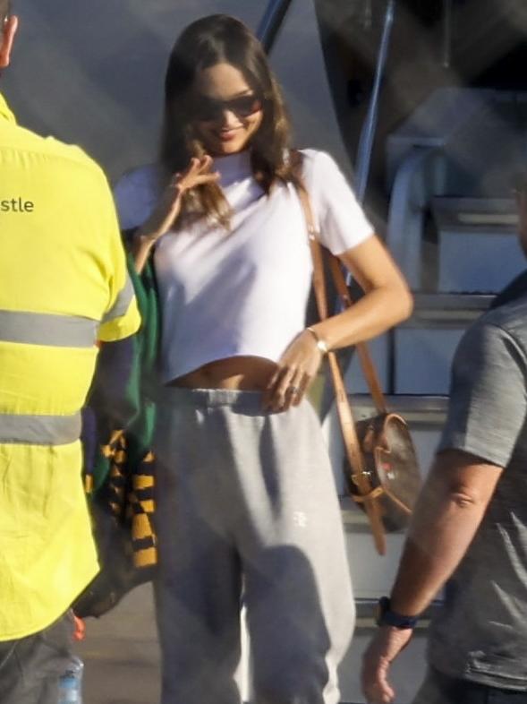 Kerr was all smiles as she stepped out of the private jet, wearing a white T-shirt, grey track pants and sneakers, accessorising with a love-heart shaped Louis Vuitton handbag. Picture: Media Mode