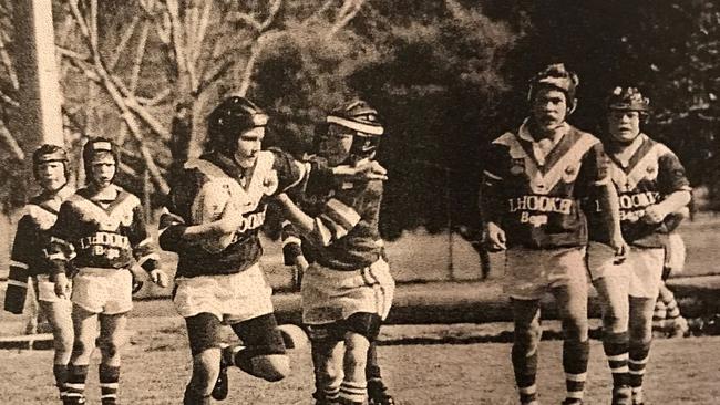 Kezie Apps carts the ball up for the Bega Roosters while Dale Finucane (right) looks on.