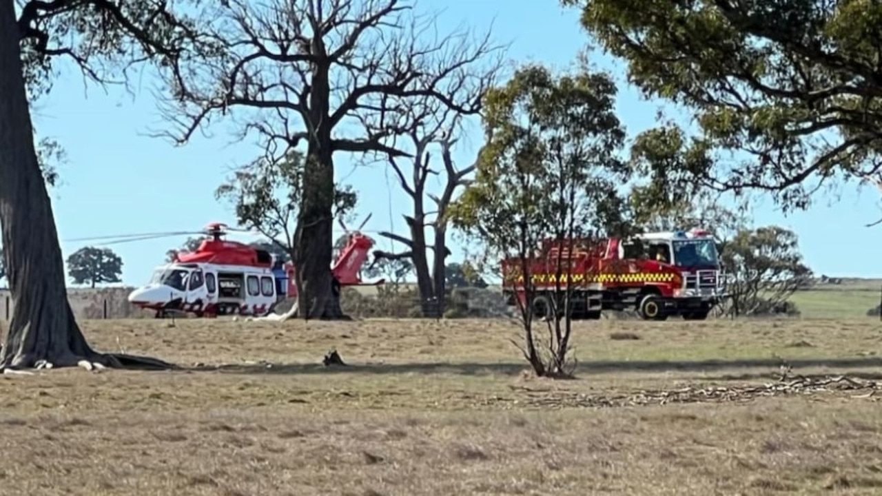 Two people have been rushed to hospital after a paraglider crashed into a paddock. Picture: ABC