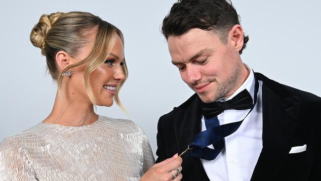 Neale and wife Julie pose for portraits after his win.