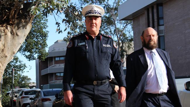 NT Police Commissioner Michael Murphy arrives at the Alice Springs Local Court on Wednesday with barrister for the force Ian Freckelton KC. Picture: Jason Walls