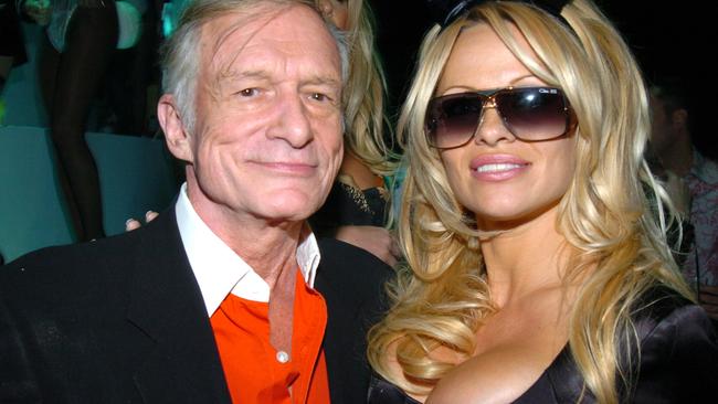 Hugh Hefner and Pamela Anderson during Playboy's 50th Anniversary Celebration in New York City - Inside at New York Armory in New York City, New York, United States. (Photo by Theo Wargo/WireImage)