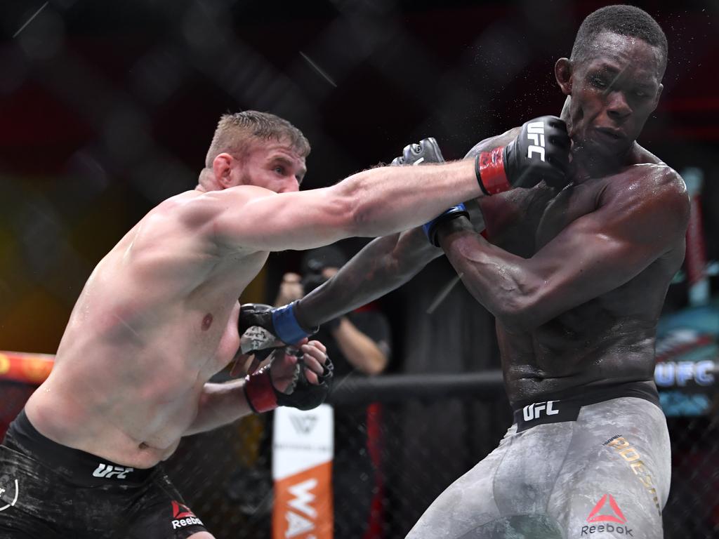 Jan Blachowicz of Poland punches Israel Adesanya.