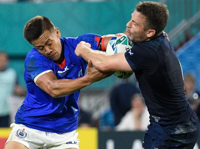 Scotland's scrum-half Greig Laidlaw evades Samoa's fullback Tim Nanai-Williams.