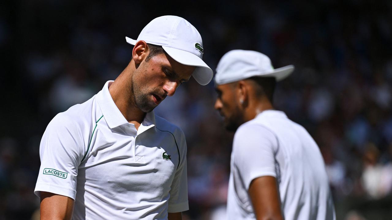Serbia's Novak Djokovic (L) walks past Australia's Nick Kyrgios during their men's singles final at Wimbledon. Photo: AFP