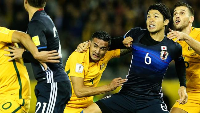 Tim Cahill battles for space against Japan. Picture: Tim Carrafa