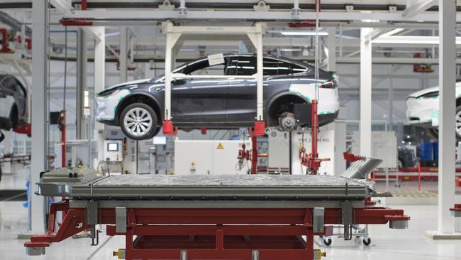 A battery pack stands on a trolley as a Tesla Model X is assembled. Rio Tinto is looking to dominate the EV battery pack supply chain. Picture: Bloomberg