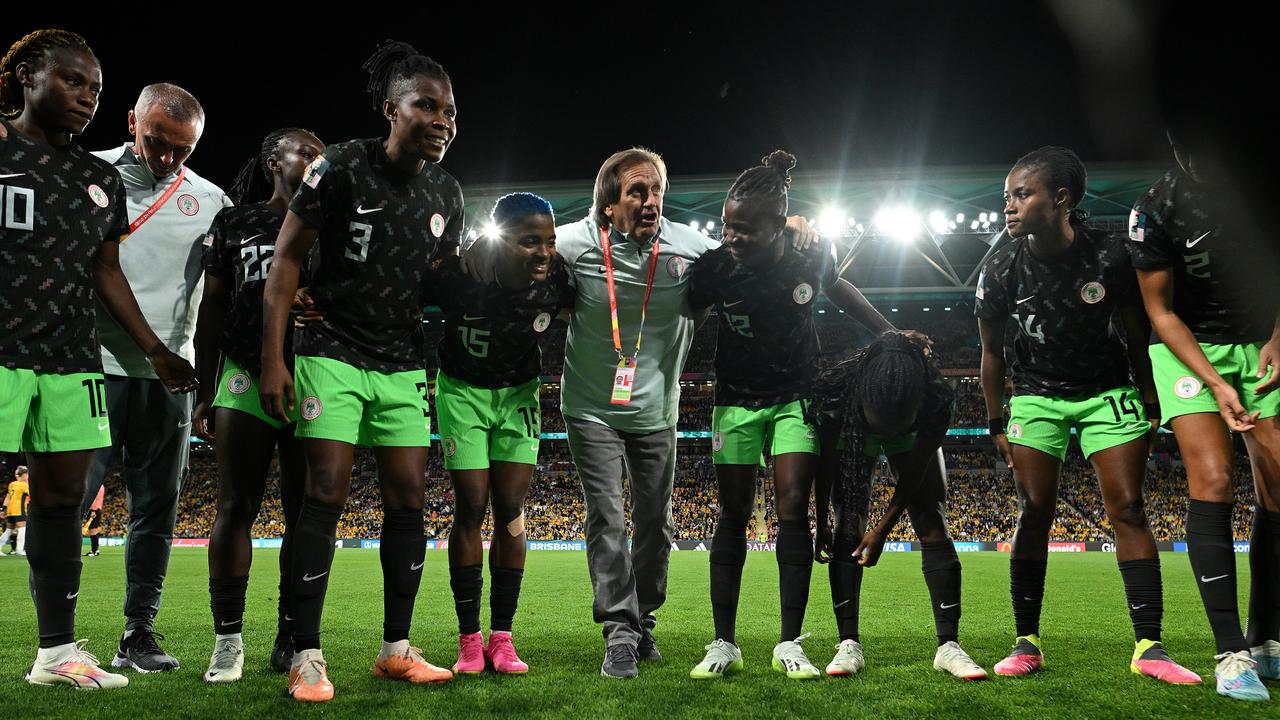 Randy Waldrum (C) addresses the team ahead of their 3-2 group stage win over Australia.