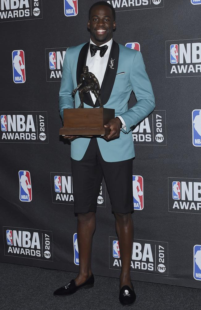 Draymond Green rocking his unique outfit with his Defensive Player of the Year Award. Picture: AP
