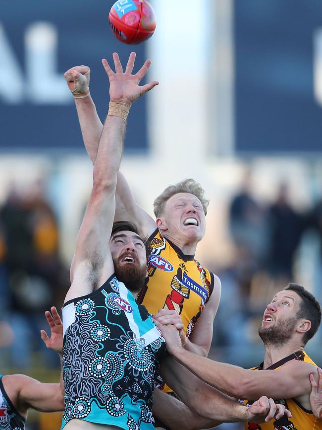 James Sicily flies for a spoil over Port’s Charlie Dixon while James Frawley roves. Picture: Scott Barbour/Getty Images