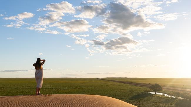The iconic red dirt and vast brown plains of the west are now a bold carpet of green. Picture Sean Scott for Outback Tourism Association.