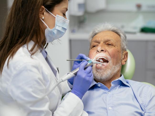 Senior man at the dentist. Shadow DOF. Developed from RAW; retouched with special care and attention; Small amount of grain added for best final impression. 16 bit Adobe RGB color profile.