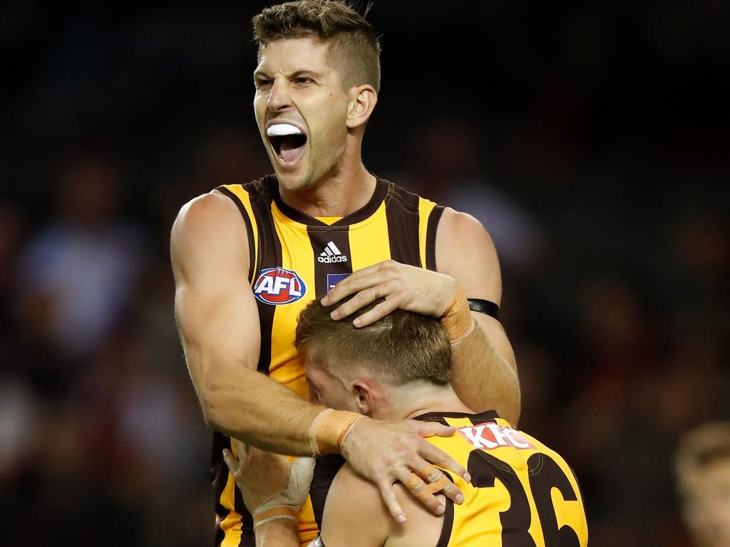 Luke Breust and Dylan Moore celebrate Hawthorn’s amazing win.