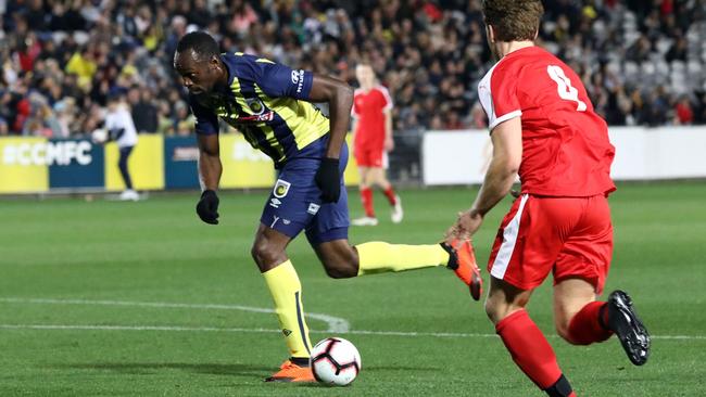 Usain Bolt in action for Central Coast Mariners during a trial match at Gosford against a Central Coast select side. Picture: AFP