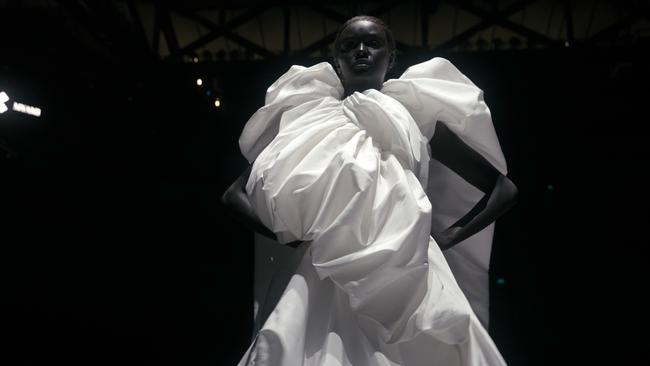 Duckie Thot in the first physical iteration of a Myami garment, on the catwalk at Melbourne Fashion Festival.