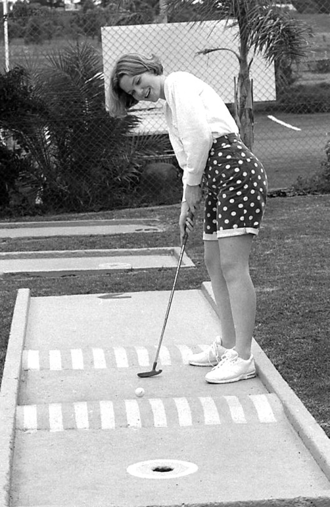 A woman plays mini golf at Willow Springs Adventure Park, Spring Street. Photo Nev Madsen