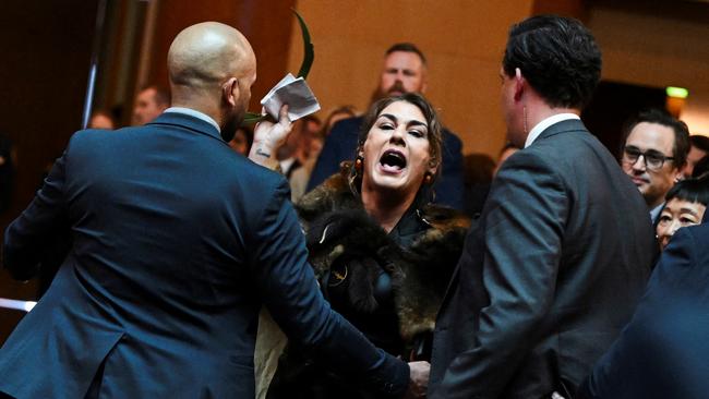 Independent senator Lidia Thorpe is escorted out of the chamber after interrupting King Charles’s appearance in parliament on Monday. Picture: Reuters