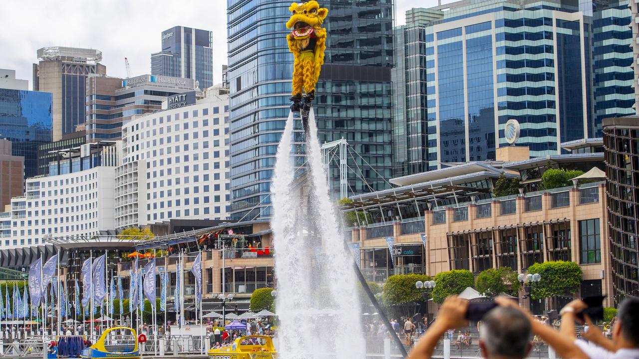 Lion Dancers practice on jet-packs before a performance at Darling Harbour during Lunar New Year’s celebrations in Sydney. Businesses in Western Harbour say the the precinct must be strengthened as an attraction for people to visit, work and live. Picture: Jeremy Piper