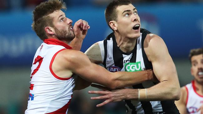 Johnson went head-to-head with Collingwood giant Mason Cox. Picture: Phil Hillyard