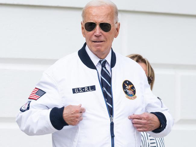 US President Joe Biden, wearing a Team USA Olympics jacket, walks to Marine One prior to departing from the South Lawn of the White House in Washington, DC, July 26, 2024 as he travels to Camp David for the weekend. Biden is travelling to Camp David for the weekend. (Photo by SAUL LOEB / AFP)