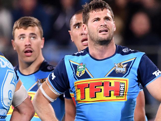 Titans players look on following a Roosters try during the Round 18 NRL match between the Gold Coast Titans and the Sydney Roosters at Cbus Super Stadium on the Gold Coast, Sunday, July 15, 2018. (AAP Image/Dave Hunt) NO ARCHIVING, EDITORIAL USE ONLY