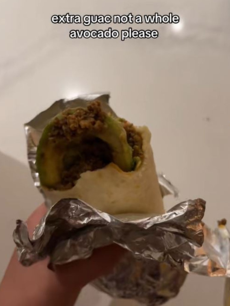 A woman has claimed she found half an avocado in her burrito after ordering extra guac. Picture: TikTok